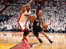 Tony Parker of the San Antonio Spurs drives against Rashard Lewis of the Miami Heat during Game Four of the 2014 NBA Finals at American Airlines Arena in Miami, Florida on June 12, 2014. Credit: Nathaniel S. Butler/NBAE/Getty Images
